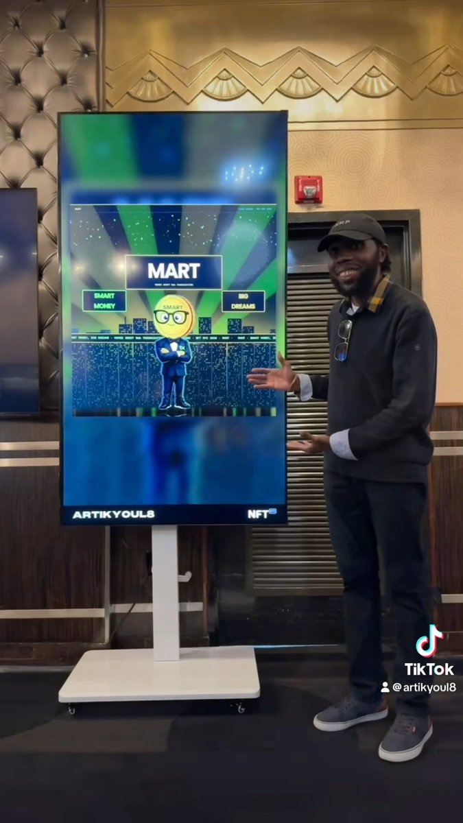 A TikTok video still showing a man in a black cap standing next to a digital display showing an NFT cartoon character labeled 'MART', with the handle '@artikyoul8'.