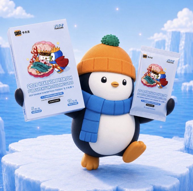 A penguin mascot wearing an orange knit hat and blue scarf holds boxes of '2026 KAKAO FRIENDS PHANTOM PUDGY PENGUINS TRADING CARDS' and individual card packs against an icy blue background.