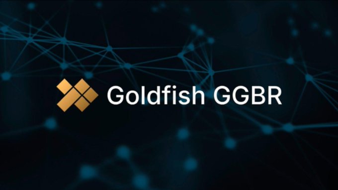 The image displays the "Goldfish GGBR" logo featuring a geometric gold diamond icon against a dark blue blockchain-themed background with interconnected network nodes. This visual branding ties directly to the post's discussion of Goldfish tokenizing gold on the blockchain, with the network motif emphasizing the project's digital/onchain infrastructure for the $GGBR token.