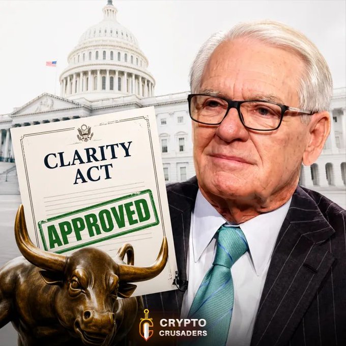 The image features an older man in a suit and tie holding up a document labeled "CLARITY ACT" stamped with "APPROVED," with the U.S. Capitol building in the background, a bronze bull statue, and a "Crypto Crusaders" logo—visually supporting the post's claim that Charles Schwab is pushing for Senate passage of the Clarity Act as bullish for crypto and XRP.