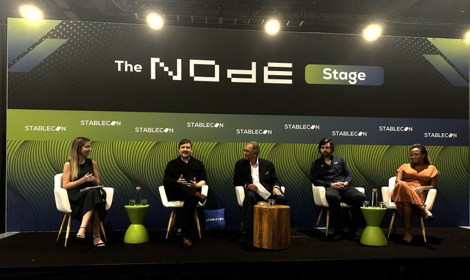 A panel discussion titled "The NODE Stage" at StableCon features five speakers seated on stage, representing companies including Yellowcard, Solana, and Celo, gathered to discuss how stablecoins are creating payment corridors in emerging markets.
