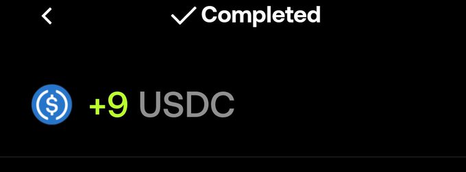 A dark mobile screen interface showing a completed transaction with '+9 USDC' next to a blue USDC coin icon.