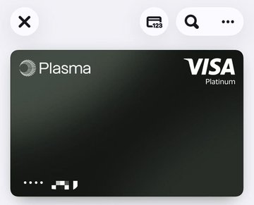 The image shows a black Visa Platinum card displayed on an iPhone screen. The card has a white border and features a logo of a globe, indicating its association with the Visa brand. The card's design suggests that it supports both physical and virtual cards, allowing users to make purchases using various payment methods such as cash or credit/debit cards. Additionally, the card can be used for top-ups with cryptocurrencies like USDT (Digital token) in a European IBAN account, providing flexibility and convenience for users.