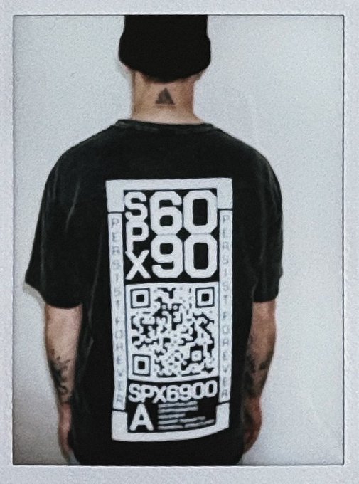 A person viewed from behind wears a black t-shirt featuring a QR code and the text "SPX6900," "860x90," "PROTOCOL x BACK x," and "SPX6900," along with a beanie and visible neck and arm tattoos, visually promoting the SPX6900 token referenced in the accompanying post urging viewers to "Look into SPX6900" and buy it daily.
