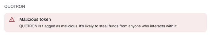 A warning notice stating: 'QUOTRON - Malicious token. QUOTRON is flagged as malicious. It's likely to steal funds from anyone who interacts with it.'