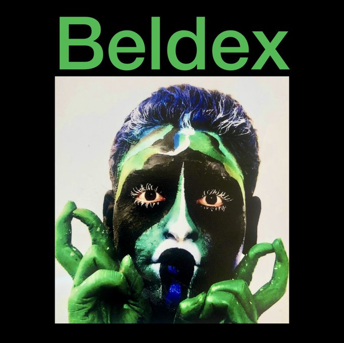 An artistic poster titled "Beldex" in green text, featuring a high-contrast image of a person with green and black face paint and green hands.