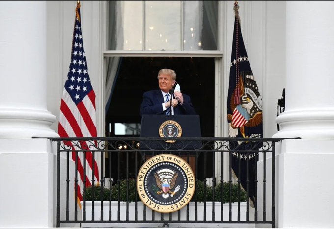 President Donald Trump stands at the White House balcony beside the presidential seal, flanked by the American flag and the presidential flag. The image accompanies a post about a congressional bill that could enable the U.S. government to acquire up to 1 million BTC—roughly 5% of Bitcoin's total supply—for a strategic reserve.
