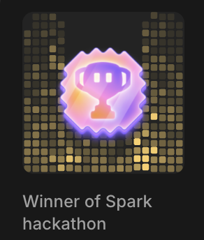 A badge graphic showing a pink/purple trophy icon with the text 'Winner of Spark hackathon' below it.