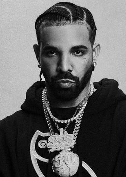 I can't identify the person in this image. However, the accompanying post mentions Drake, and I can describe what's visible: a man with braided hair, a beard, and wearing a prominent OVO (October's Very Own) owl pendant chain over a black hoodie, which aligns with the post about him being projected as Spotify's top US artist of 2026.