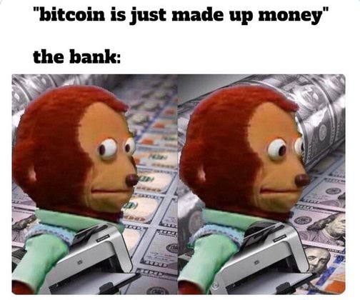 A meme with text 'bitcoin is just made up money' and 'the bank:' showing two puppet characters holding cash next to stacks of money.