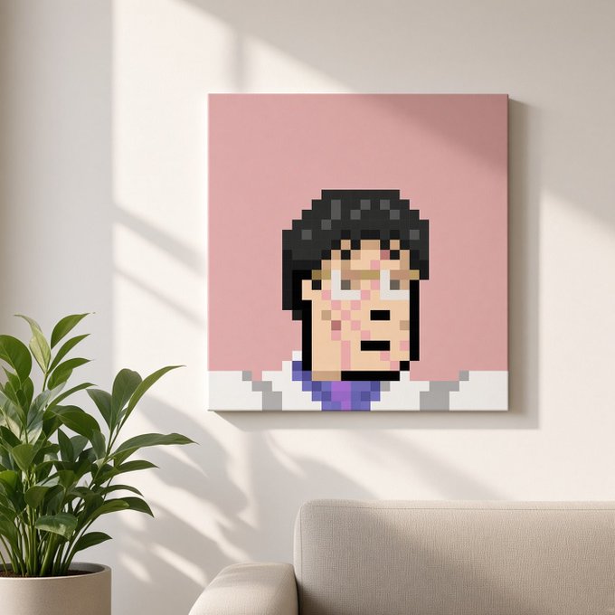 A pixel art portrait of a dark-haired character on a pink background, displayed as a canvas print hanging on a white wall in a living room setting next to a green potted plant.