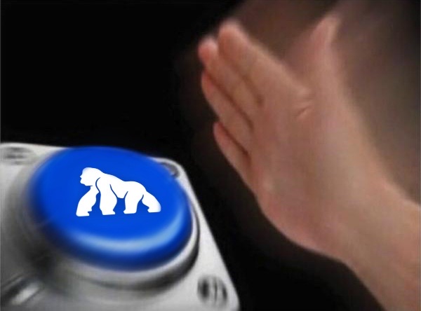 A hand reaches toward a blue button featuring a white gorilla icon on what appears to be an electronic device.