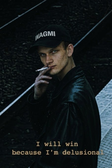 A moody portrait of a young man wearing a black 'WAGMI' cap and leather jacket, smoking a cigarette, with the text 'I will win because I'm delusional' displayed below.