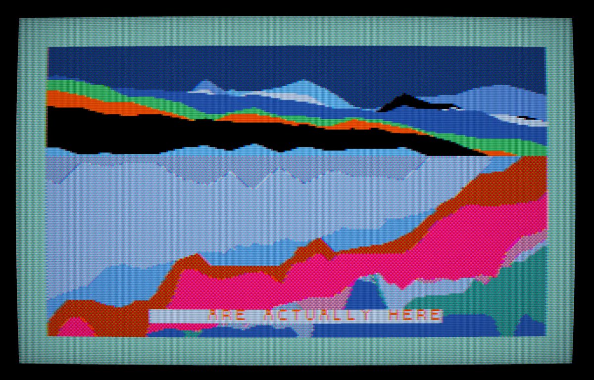 The image features a colorful painting of mountains, with a blue sky and green hills. The painting has been crocheted into a square shape, giving it an artistic touch. The text "THE REALITY HERE" is written below the painting, possibly indicating that this artwork represents a specific situation or event in reality.