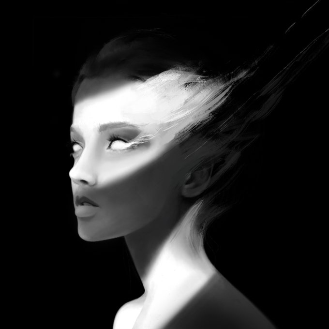 A high-contrast black and white artistic portrait of a woman's face with light streaming across it, obscuring her eyes with white light and giving the image a dramatic, ethereal quality.