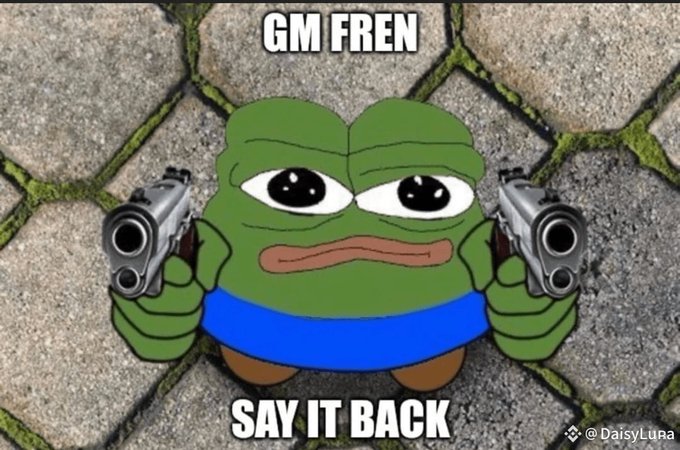 A Pepe the Frog meme holding two pistols, with text reading 'GM FREN' at the top and 'SAY IT BACK' at the bottom.