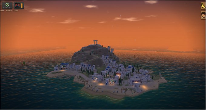 A stylized, blocky island settlement sits on a sandy coastline under an orange sunset, with white buildings, dark green trees, lit paths, and a small tower or structure on the hilltop. The scene appears to be a game screenshot with interface icons in the top corners and partly legible text in the upper left, including “AND” and “PAINTER LAYOUT,” matching the post’s playful idea of the scenic coastal spot as “prime real estate.”