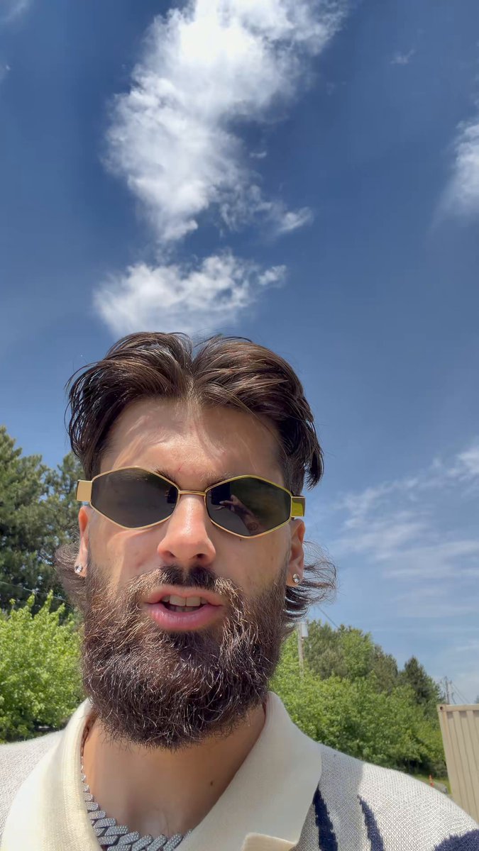 iced coffee with a gold rim, sunglasses, and a beard are featured on the cover of a book titled "The Art of Coffee" by a renowned author.