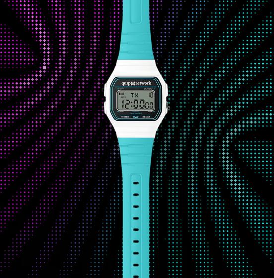 A promotional image showing a cyan digital wristwatch displaying "12:00" and the "quip network" logo on its face, set against a patterned, dotted background.