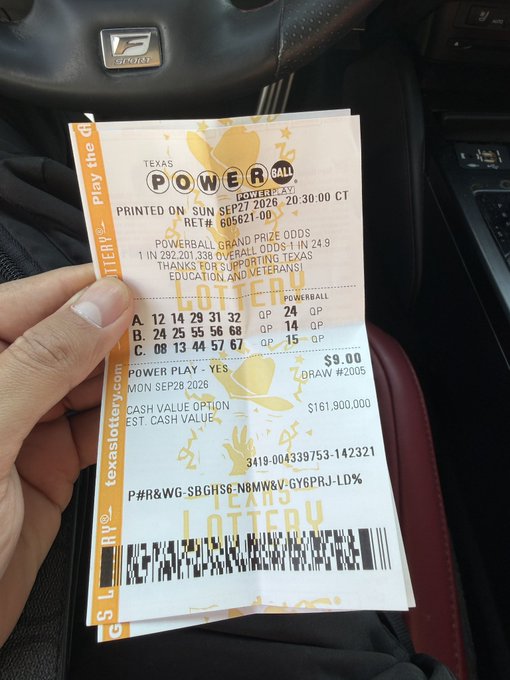 A hand holds two Texas Lottery Powerball tickets inside a car, showing a September 27, 2026 draw with a cash value option of $161,900,000.