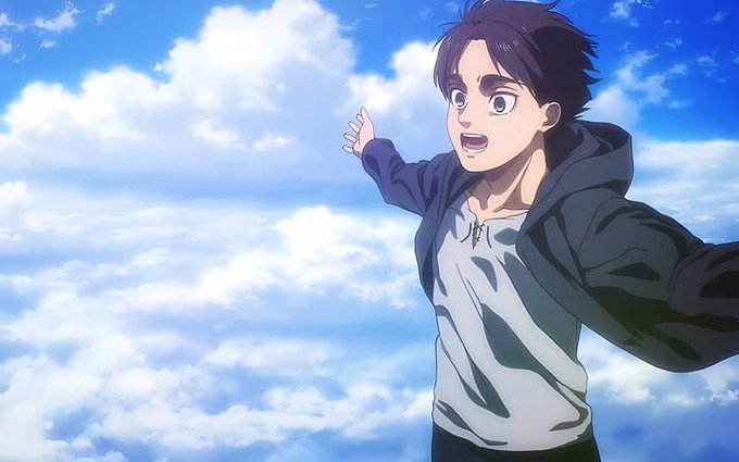 An anime-style illustration of a young man with dark hair wearing a hooded jacket, standing against a bright blue sky with scattered white clouds.