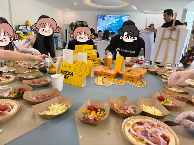iced tea, pizza boxes, and a whiteboard with "Grown" written on it are present at an art class gathering.
