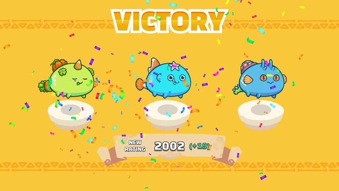 A 'VICTORY' screen from a colorful game showing three pufferfish-like characters (green, blue, and another blue) on podiums with confetti falling, displaying a 'NEW RATING' of 2002 (+19) at the bottom.