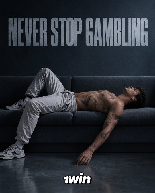 A motivational poster showing a tattooed shirtless man sprawled across a dark gray sofa with the text "NEVER STOP GAMBLING" above him and "1win" below.