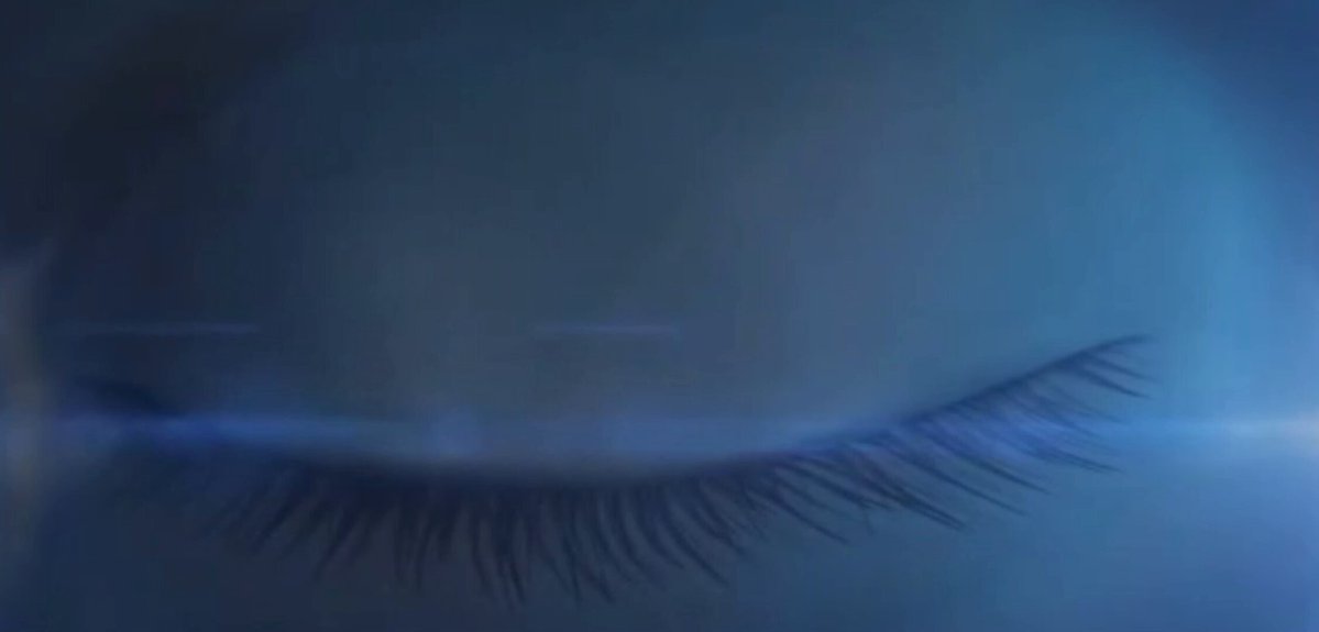 The image shows a close-up view of an eye with long eyelashes against a dark blue background. The eye appears to be closed or half-closed, giving the impression that someone has been staring at something for quite some time. The image is accompanied by text that reads "hey, spent the last couple hours playing with codexero v2 on base and honestly it blew my mind how far prompt-to-dapp has come." This suggests that the person who took this photo might have been using a prompt-to-dapp tool to create an interesting or visually appealing image.