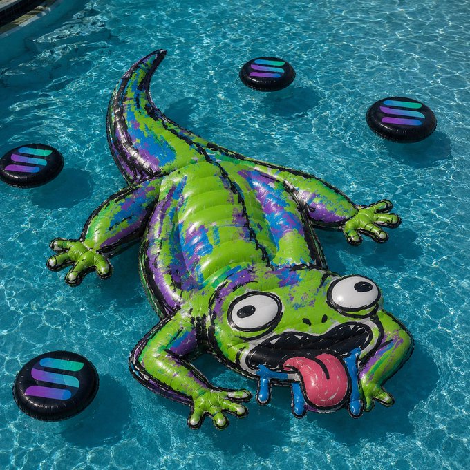 A vibrant inflatable pool toy shaped like a green and purple lizard with a goofy tongue-out expression floats in a pool, surrounded by colorful orbs. The cartoonish creature's playful, meme-worthy vibe fits the lighthearted "pool party at 1 million market cap" $LAZI celebration.