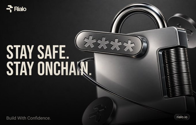 A promotional graphic for Rialo with the slogan 'STAY SAFE. STAY ONCHAIN.' featuring a metallic padlock with asterisk characters, branded 'Rialo - Build With Confidence.'