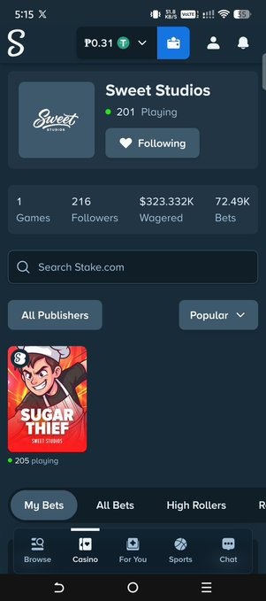 A mobile screenshot shows the Stake.com interface featuring 'Sweet Studios', displaying '201 Playing' and statistics like '216 Followers' and '$323.332K Wagered', with a 'SUGAR THIEF' game thumbnail visible.