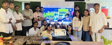 The image is blurry and shows a group of students standing together at what appears to be an educational event, with a banner in the background reading "Building India Onchain" and "@IndiaOnchain." The scene captures the enthusiastic gathering of curious young minds in Vidisha, reflecting the post's description of students coming together to learn about blockchain technology and take their first steps onchain.