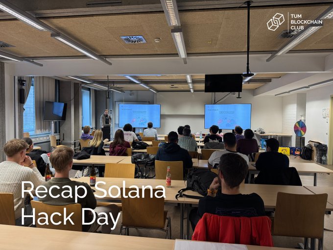 A photo taken from the back of a classroom during a presentation at TUM Blockchain Club, with the overlay text 'Recap Solana Hack Day' in the bottom left corner.