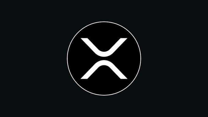 A minimalist logo showing the XRP (Ripple) cryptocurrency symbol—stylized white 'X' inside a black circle on dark background.