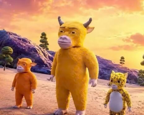 A 3D animated scene featuring three yellow animal characters—a large bull-like creature, a monkey, and a leopard cub—standing in a desert landscape at sunset.