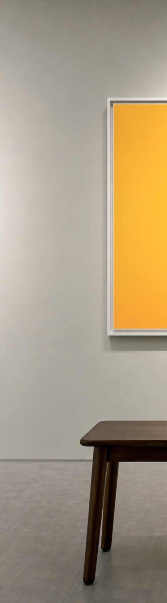 A minimalist gallery scene featuring a vibrant orange monochrome artwork mounted on a soft gray wall, paired with a dark wooden bench on a polished concrete floor. The bold, empty orange canvas mirrors the artwork's title "he inherited the thorn," evoking themes of solitary inheritance and stark legacy.