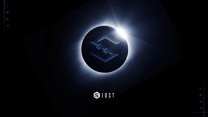 A dark promotional graphic featuring a solar eclipse with a pixelated "E" logo inside it, and the "IOST" name displayed vertically along the edges and horizontally at the bottom. The eclipse imagery visually represents the engineering and technical focus of the IOST development update, with the partially obscured "sun" symbolizing transparency into the team's behind-the-scenes infrastructure work.