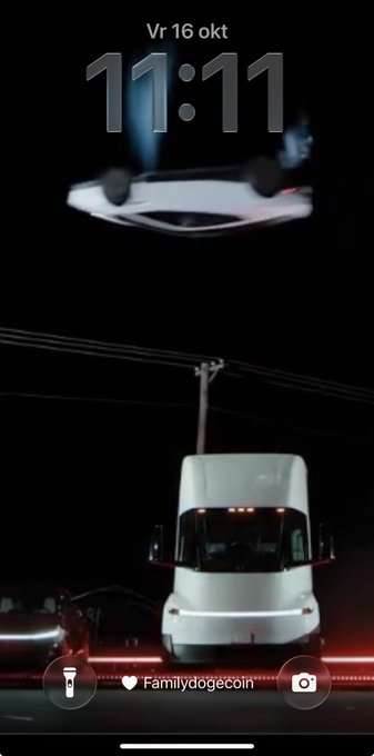 A phone lock screen displaying the time '11:11' on 'Vr 16 okt', featuring a wallpaper of a white truck parked beneath a levitating car and a wallpaper customization widget labeled 'Familydogecoin'.