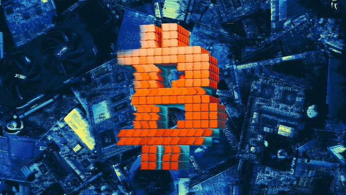 An aerial cityscape rendered in cool blue tones overlaid with a large, bright orange Bitcoin symbol composed of block-like segments.
