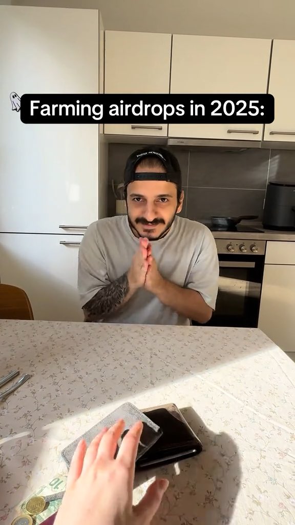 A man wearing a backwards cap sits at a kitchen table with hands clasped in a pleading gesture, with text overlay reading 'Farming airdrops in 2025:' and a ghostly hand holding a wallet visible at the bottom.