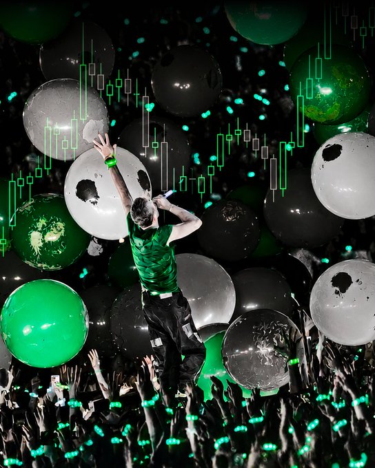 A crowd-surfing performer in a green shirt is hoisted above an audience surrounded by floating green and white balloons, with overlaid green candlestick charts mirroring the post's bullish "green candles" market metaphor.