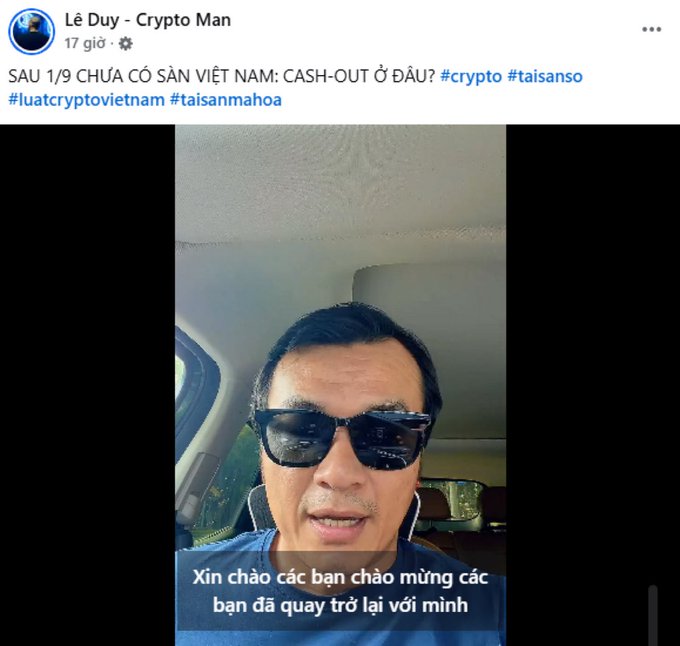A Facebook post by 'Lê Duy - Crypto Man' with Vietnamese text about crypto assets in Vietnam, featuring a selfie video of a man wearing sunglasses in a car.