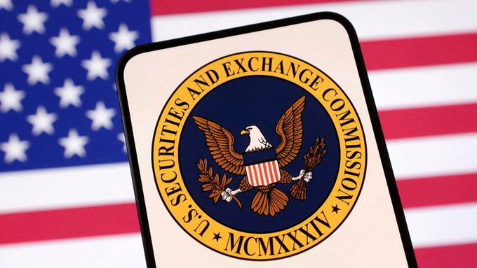 The U.S. Securities and Exchange Commission (SEC) seal displayed on a tablet with an American flag in the background.