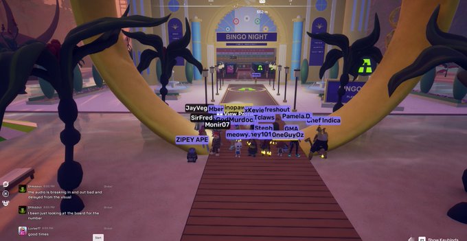 The image captures a virtual "Bingo Night" event in OthersideMeta, with player usernames like "JayVeg," "SirFred," "ZIPEY APE," and "OneGuyOz" visible above avatars gathered on a stage. The scene matches the post's excitement about the fun Bingo Night experience, showing the festive event venue with a "BINGO NIGHT" banner and gameplay timer at the top.