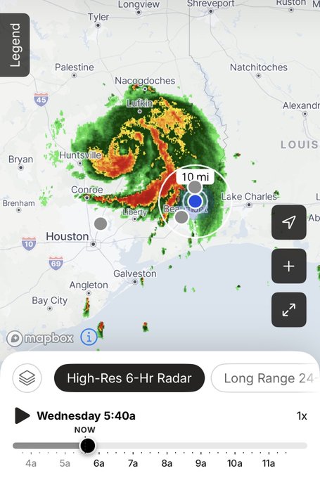 A high-resolution 6-hour radar screenshot showing a massive rotating storm system (likely a hurricane) over the Texas-Louisiana border near Beaumont and Lake Charles, with the user's location marker placed about 10 miles from the storm's eye. The timestamp reads "Wednesday 5:40a NOW" at the bottom, with the caption "GM. This crazy thing lasted all night" reflecting how the storm has been hammering the area through the overnight hours.