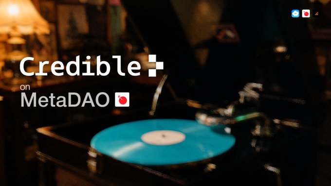 A vintage record player spinning a blue vinyl record serves as the backdrop for the text "Credible on MetaDAO," reinforcing the post's message about Credible's ICO on MetaDAO, which has raised $26M from over 600 contributors with 48 hours remaining.