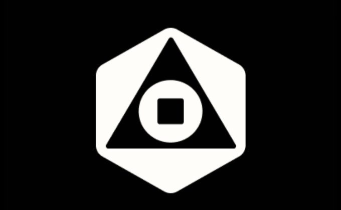 A black and white logo featuring a triangular symbol with a circle and square inside, set within a hexagonal shape.