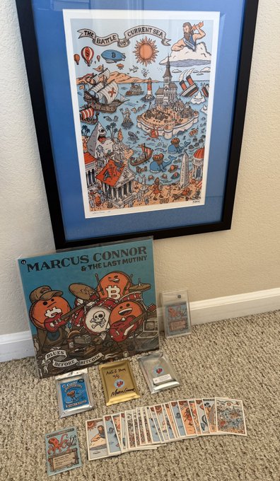 A framed print of 'THE BATTLE OF CURRENT SEA' hangs on a wall above a copy of 'MARCUS CONNOR & THE LAST MUTINY' board game with cards and pieces arranged on the carpet.