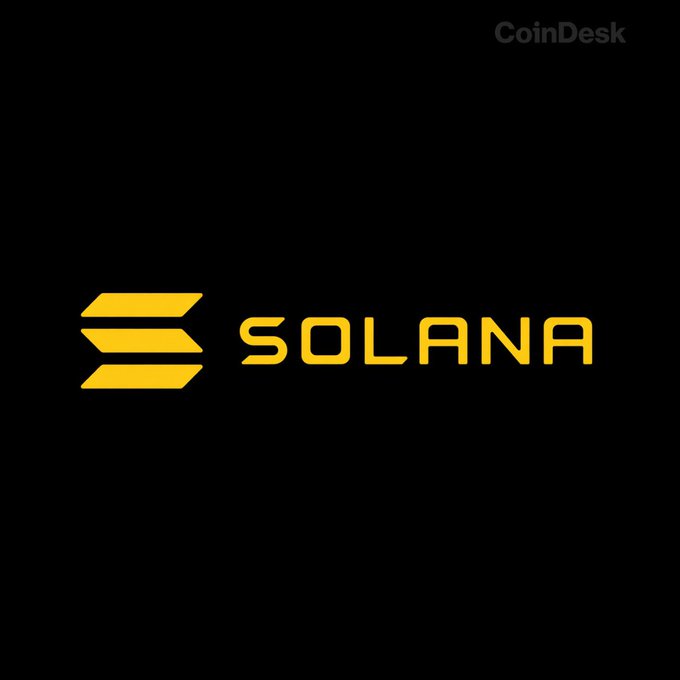 The image displays the Solana logo, featuring its distinctive yellow gradient symbol of three stacked angled bars alongside the word "SOLANA" in bold yellow lettering on a black background, with a "CoinDesk" watermark in the upper right corner. The logo corresponds to the post announcing Solana's Alpenglow upgrade scheduled for October 21, which aims to drastically improve transaction finality to ~150ms.